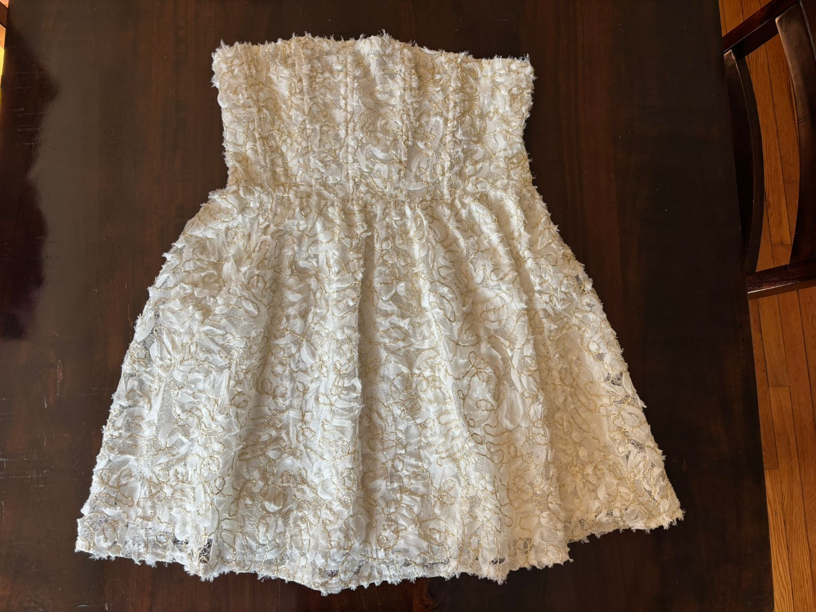 storia white strapless dress with gold accents