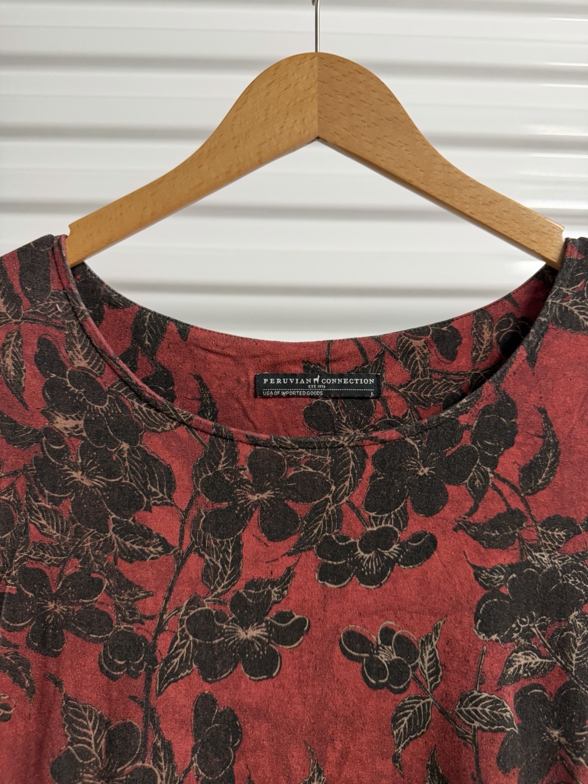 Peruvian Connection dress, featuring a red and black floral print