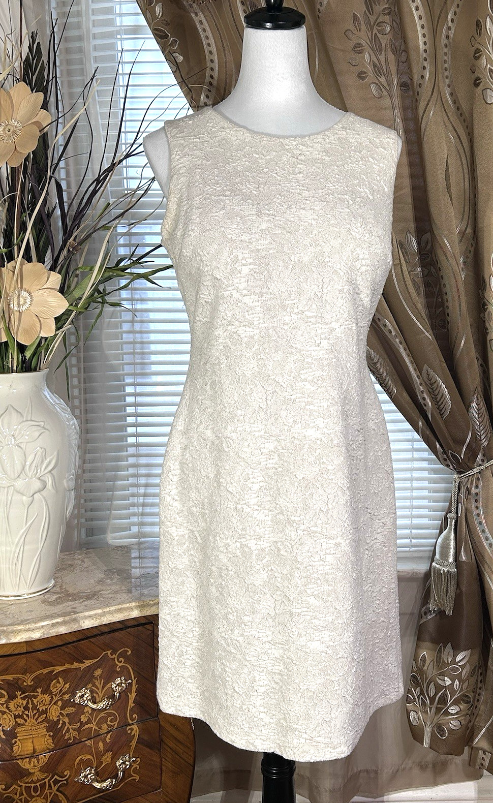 Ivory sleeveless dress crew neckline medium length for spring business or social