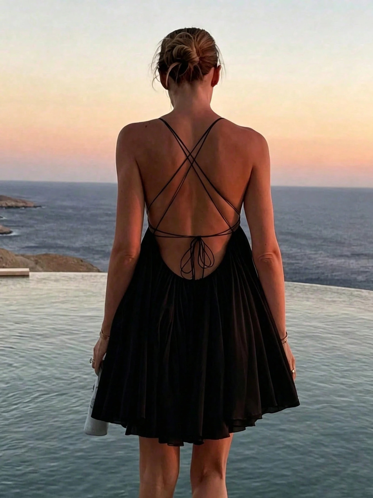Elegant women’s mini dress with spaghetti straps in black