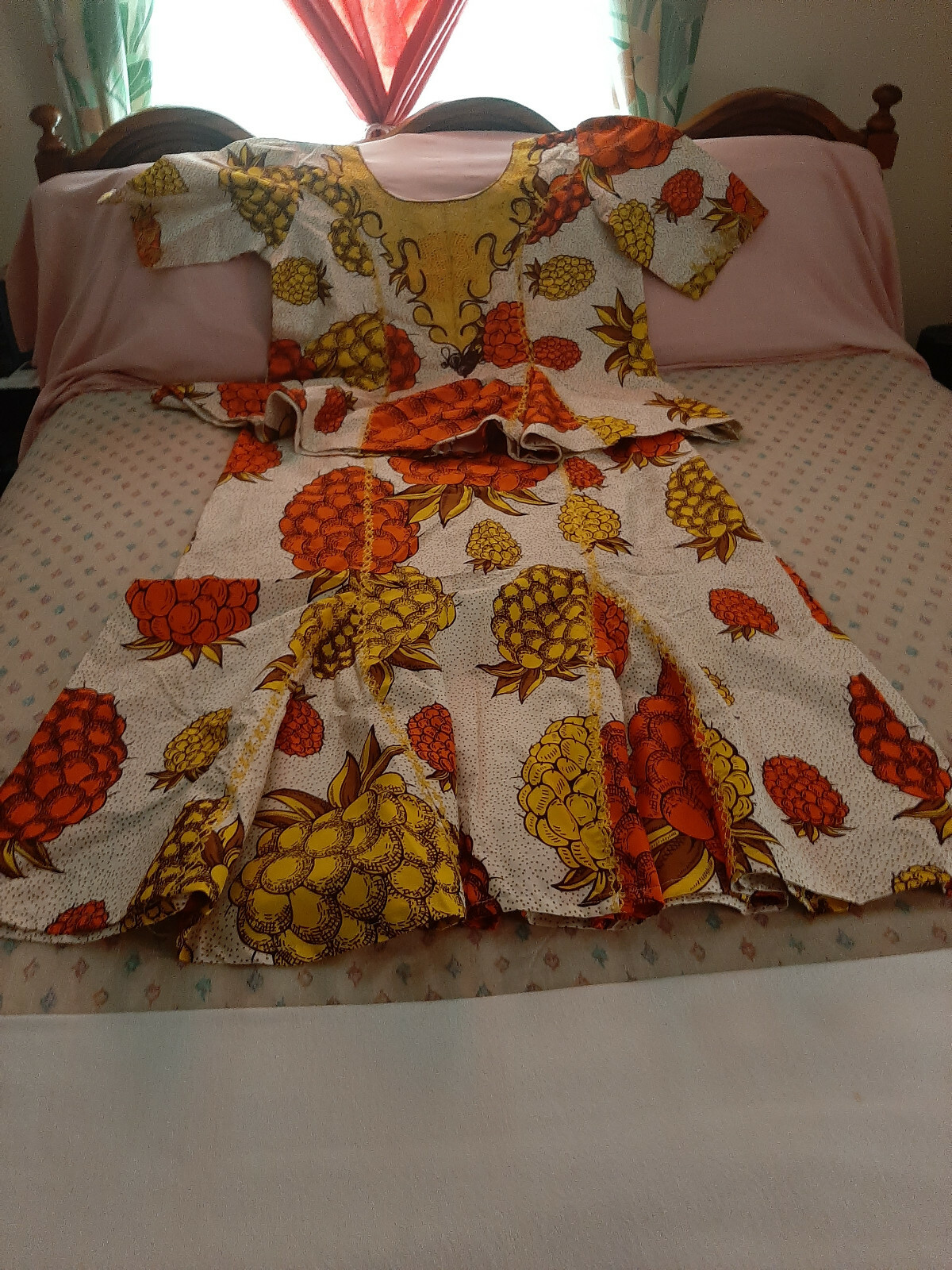 Women’s two piece African attire garment with different types and colors of pine