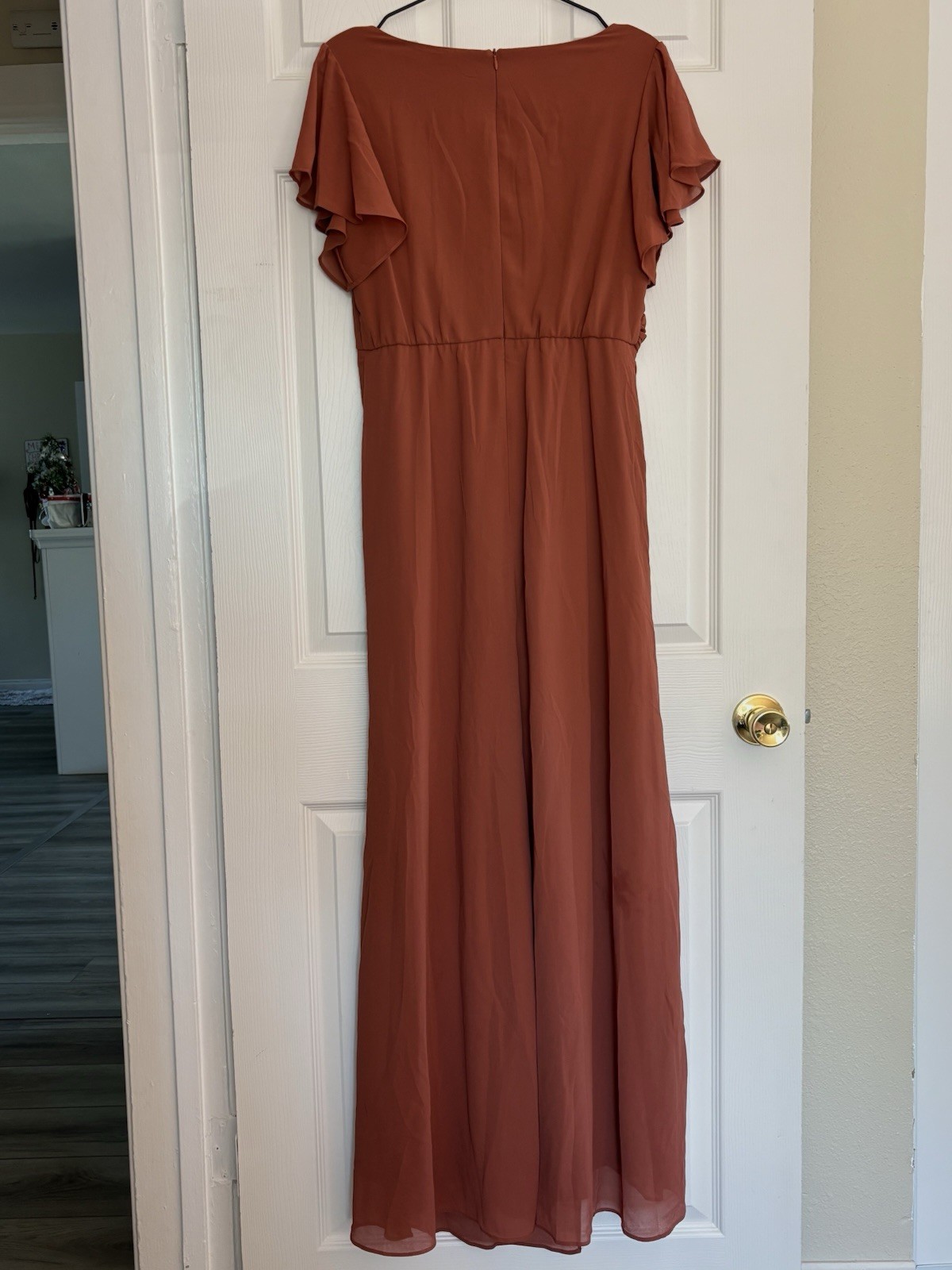 Rust-colored maxi dress with flowy overlay for weddings or fall events.