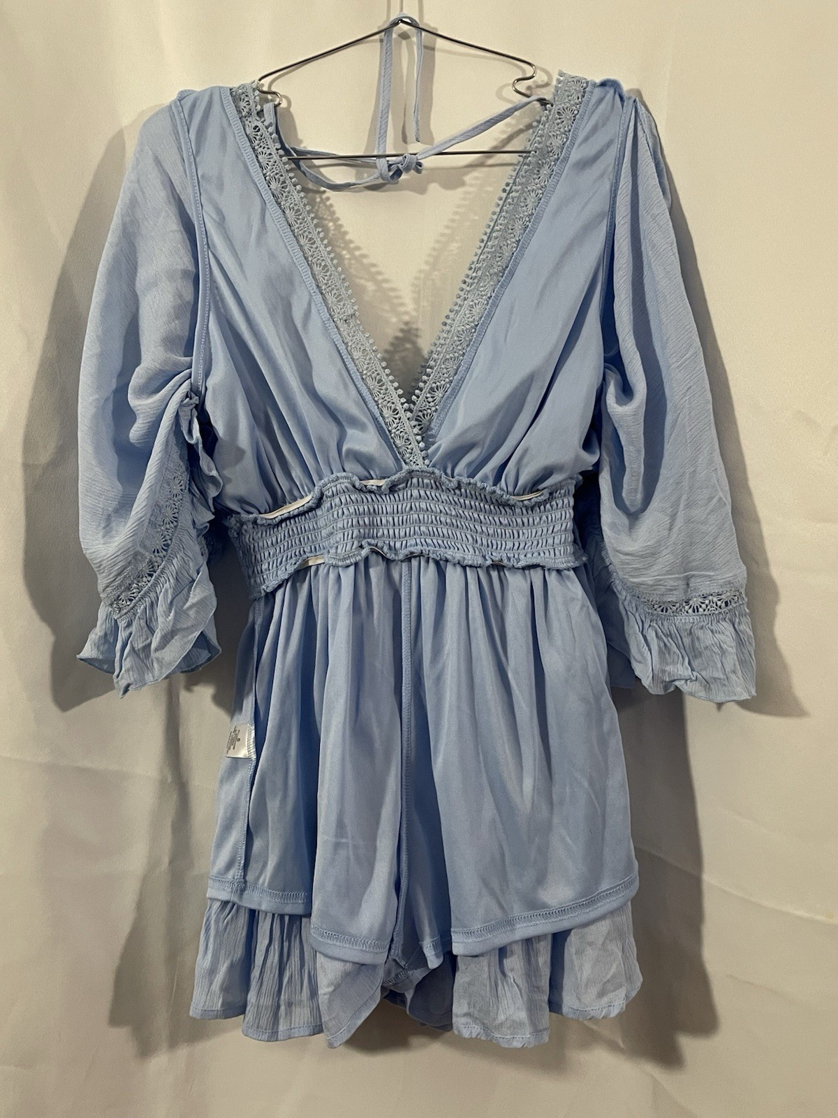 2 women’s dresses: one light blue Shero (size S, wide sleeves) and one white